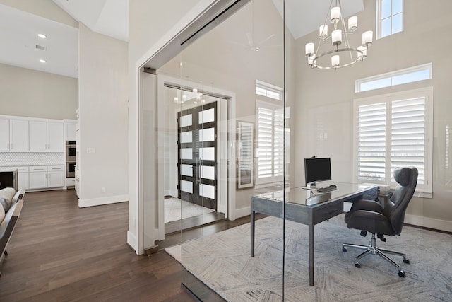 4103 Willowisp Ct, Fulshear, TX 77441 - office space featuring a towering ceiling, dark wood-style flooring, healthy amount of natural light, a chandelier, and recessed lighting