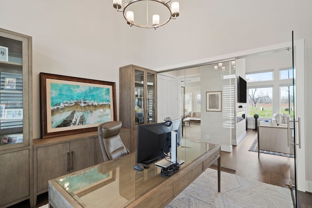 4103 Willowisp Ct, Fulshear, TX 77441 - home office featuring a chandelier, wood finished floors, and a high ceiling
