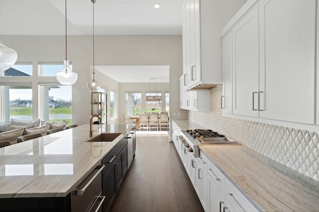 4103 Willowisp Ct, Fulshear, TX 77441 - kitchen with appliances with stainless steel finishes, white cabinetry, a kitchen island with sink, and recessed lighting