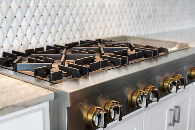 room details with white cabinets and range