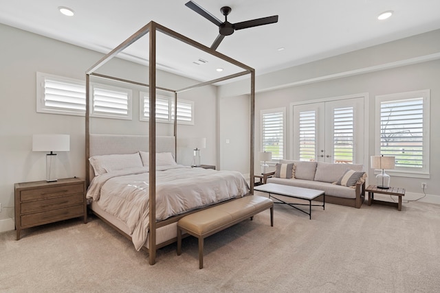 bedroom featuring recessed lighting, baseboards, multiple windows, and light colored carpet