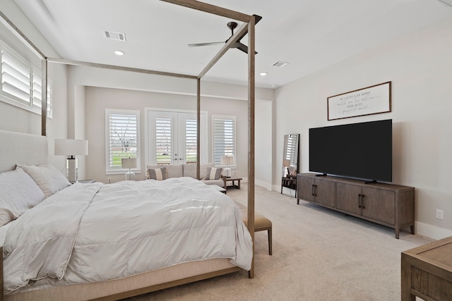 bedroom with recessed lighting, visible vents, light carpet, and baseboards