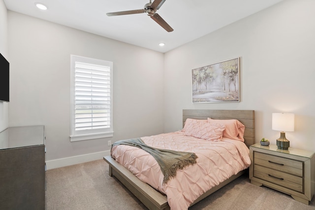 bedroom featuring light carpet, recessed lighting, a ceiling fan, and baseboards