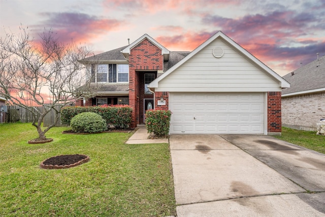 traditional home with driveway, brick siding, an attached garage, and a front yard