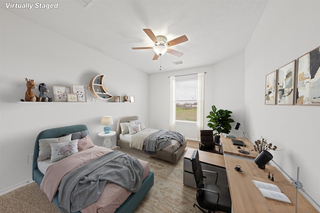 bedroom featuring carpet, baseboards, visible vents, and ceiling fan