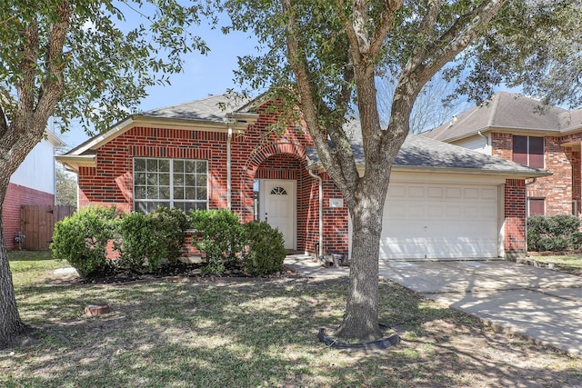 view of front of property with an attached garage, brick siding, fence, concrete driveway, and roof with shingles