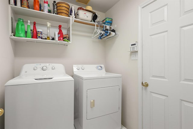 laundry room with washing machine and dryer and laundry area