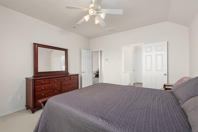 bedroom with vaulted ceiling, a ceiling fan, visible vents, and light colored carpet