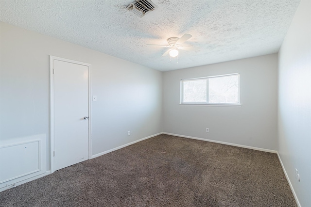 spare room with visible vents, baseboards, carpet floors, a textured ceiling, and a ceiling fan