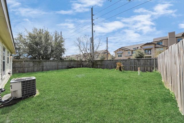 view of yard with cooling unit and a fenced backyard