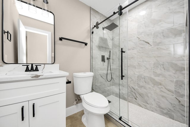 full bath with toilet, tile patterned floors, a shower stall, and vanity