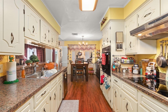 kitchen with dark wood-style flooring, a notable chandelier, a sink, under cabinet range hood, and black appliances