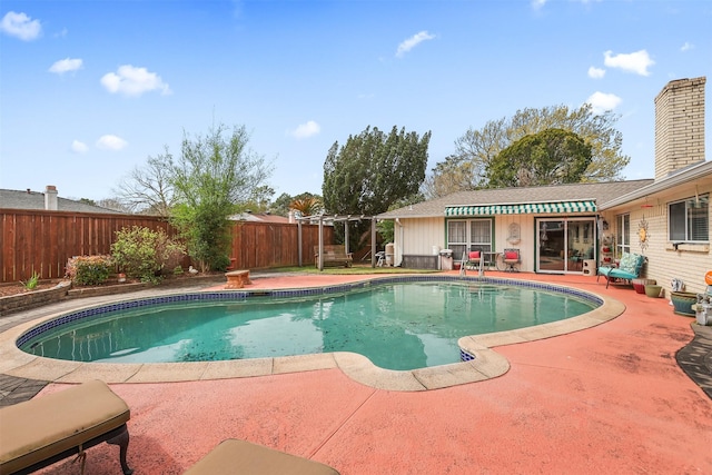 view of swimming pool with a patio area, a fenced backyard, and a fenced in pool