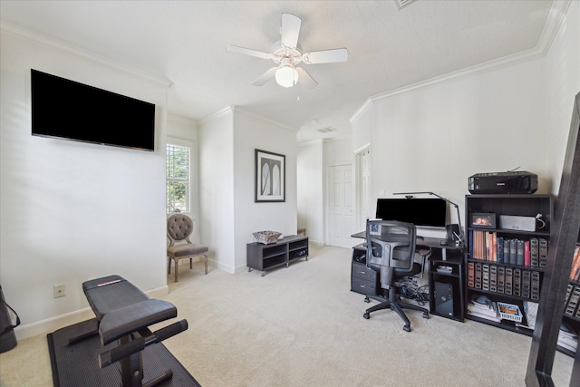 carpeted office featuring ceiling fan, baseboards, and ornamental molding