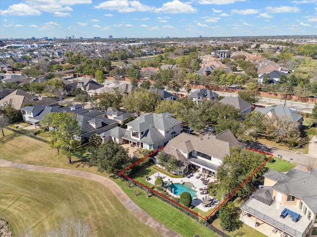 birds eye view of property with a residential view