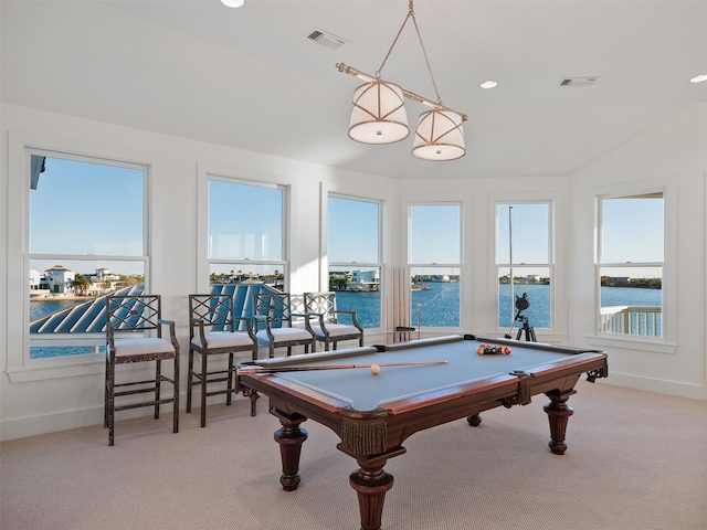 recreation room with light colored carpet, visible vents, a water view, and recessed lighting