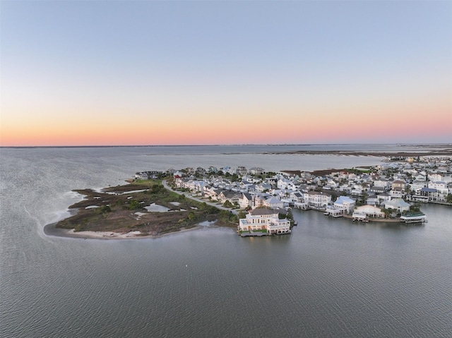 aerial view at dusk with a water view