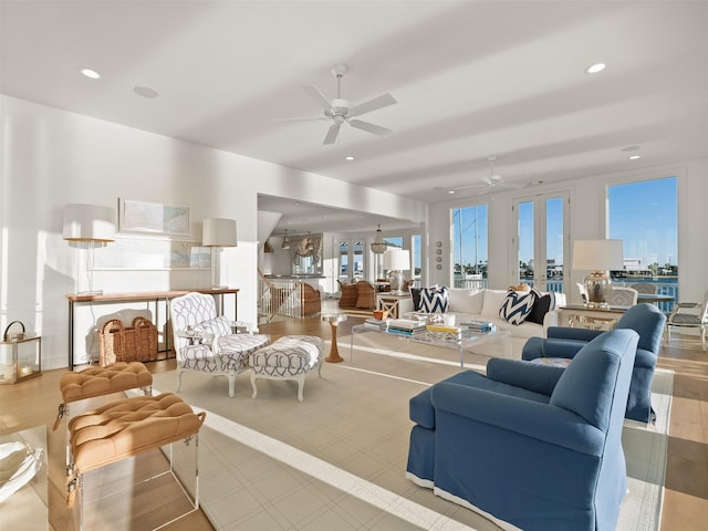 living room featuring a ceiling fan and recessed lighting