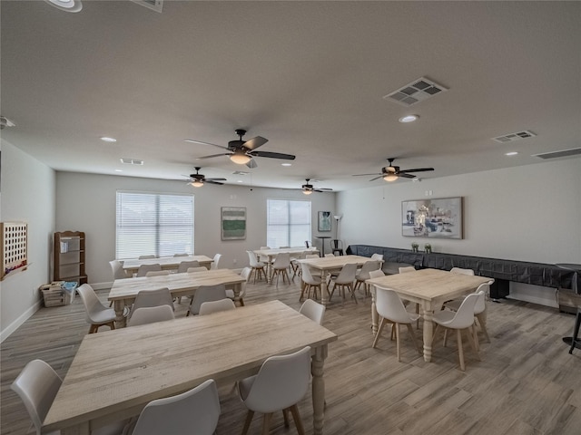 dining space with a healthy amount of sunlight and visible vents