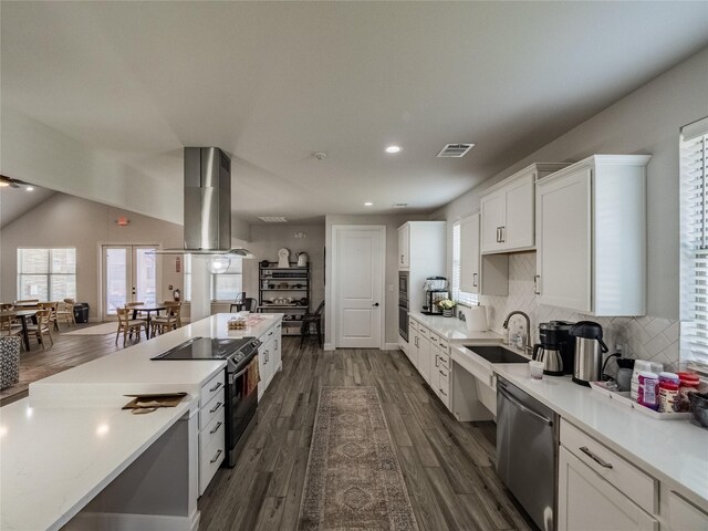 kitchen featuring visible vents, island exhaust hood, light countertops, black range with electric stovetop, and dishwasher