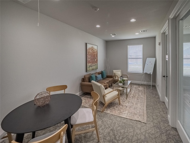 living area with visible vents, recessed lighting, attic access, and baseboards