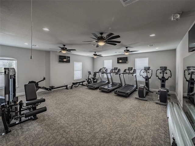 workout area featuring recessed lighting, carpet, and baseboards