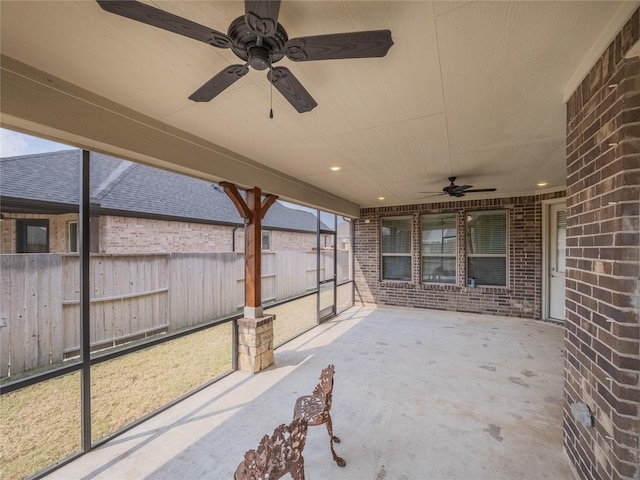 view of patio featuring fence and ceiling fan