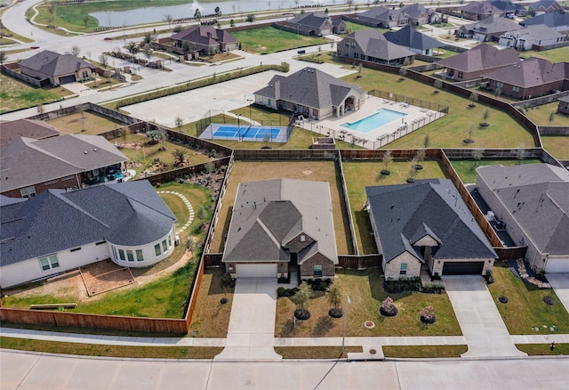 birds eye view of property featuring a residential view and a water view