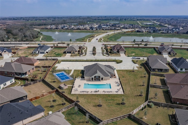 bird's eye view featuring a residential view and a water view