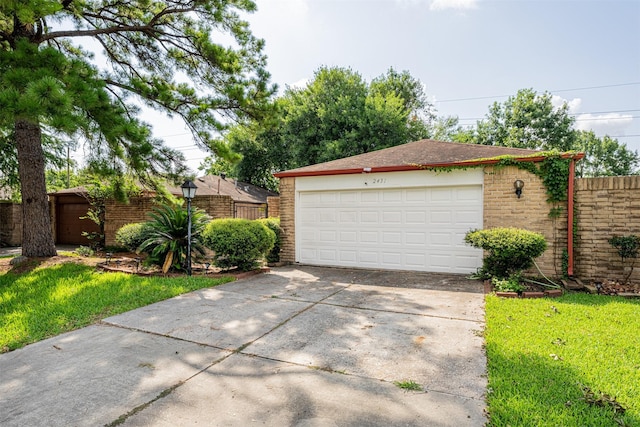 detached garage with fence