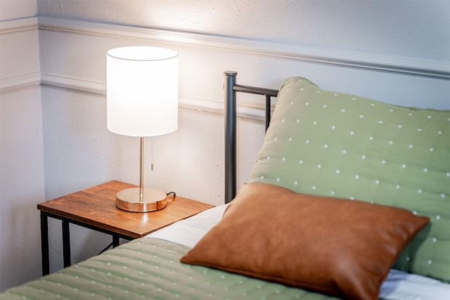 bedroom featuring a textured wall