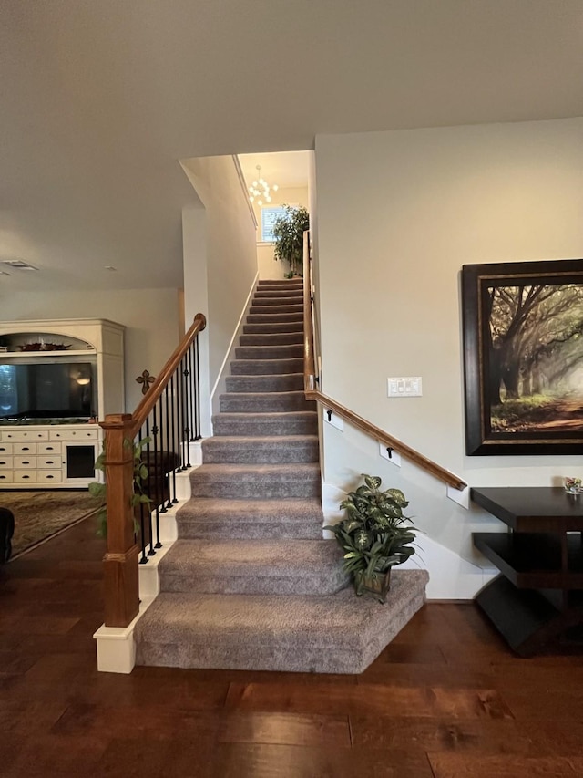 staircase with wood finished floors