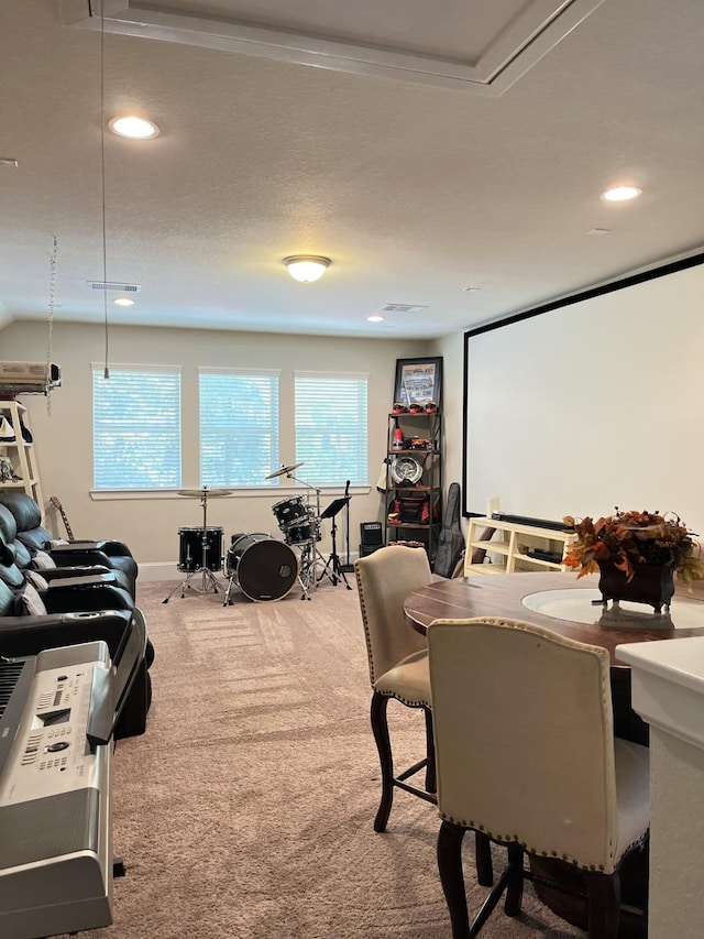 carpeted home theater featuring recessed lighting, visible vents, and baseboards