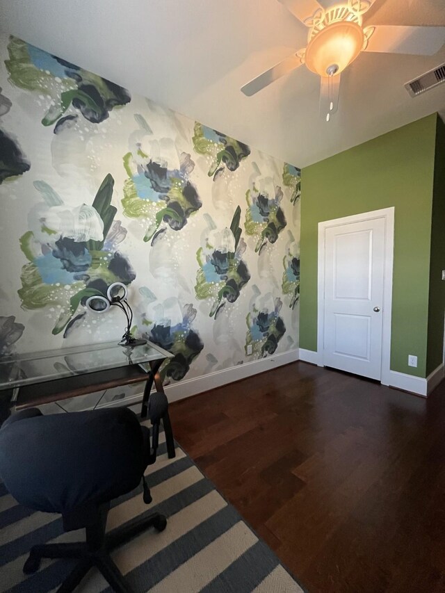 office area with baseboards, visible vents, and dark wood finished floors