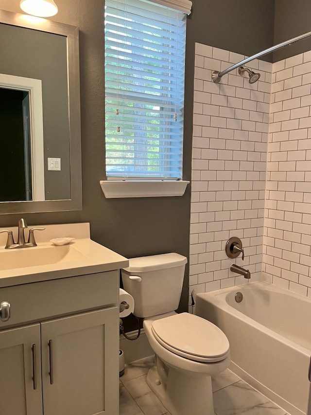 bathroom featuring shower / bathtub combination, marble finish floor, vanity, and toilet