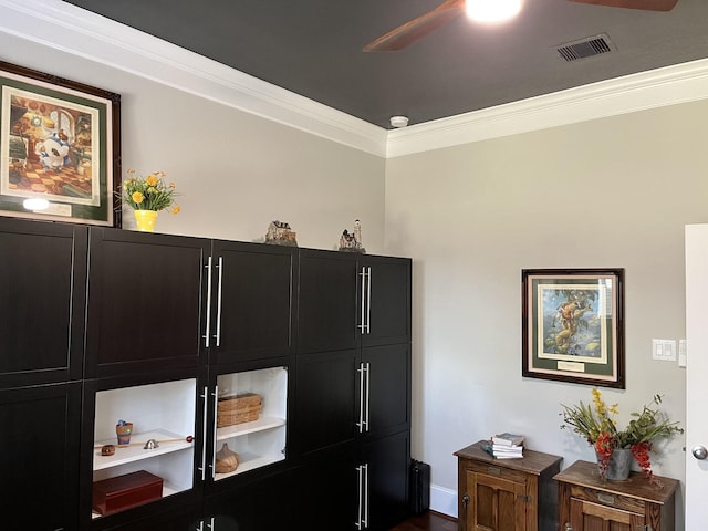 details featuring a ceiling fan, visible vents, and crown molding