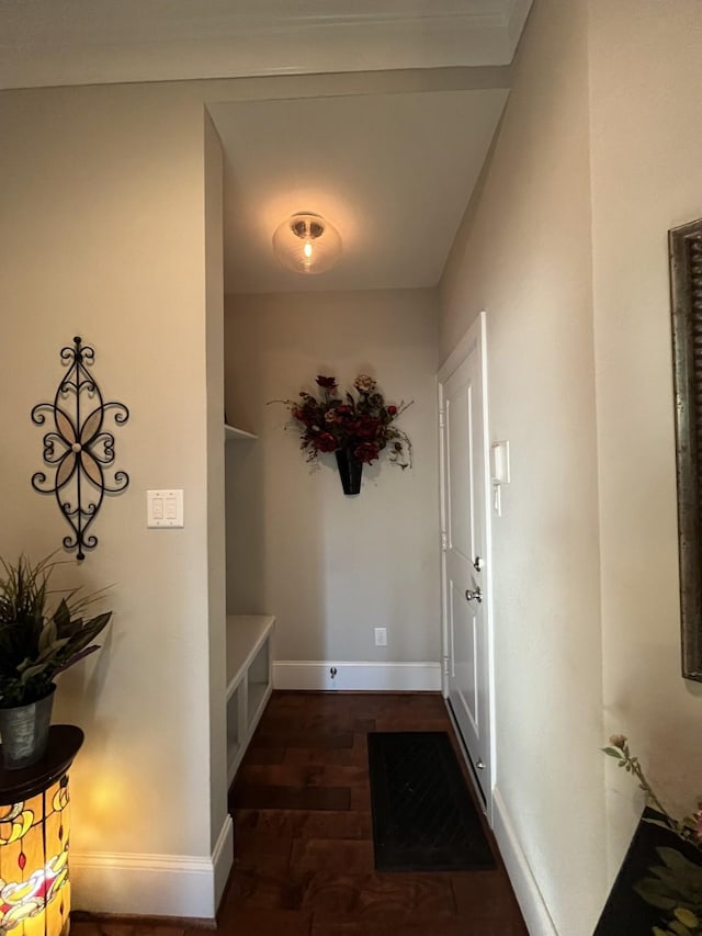 entrance foyer with baseboards and wood finished floors