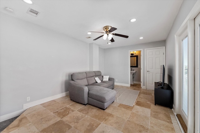 living area with recessed lighting, visible vents, baseboards, and a ceiling fan