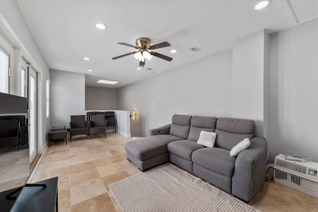 living room with recessed lighting, visible vents, and a ceiling fan