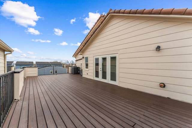 wooden terrace featuring french doors and central AC