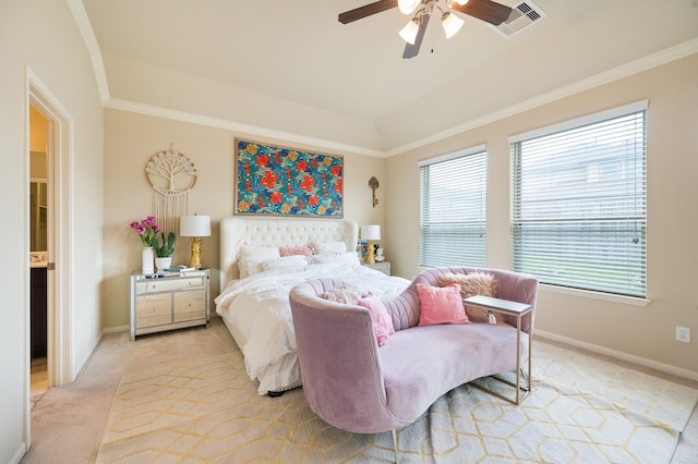 bedroom with ornamental molding, light carpet, ceiling fan, and baseboards