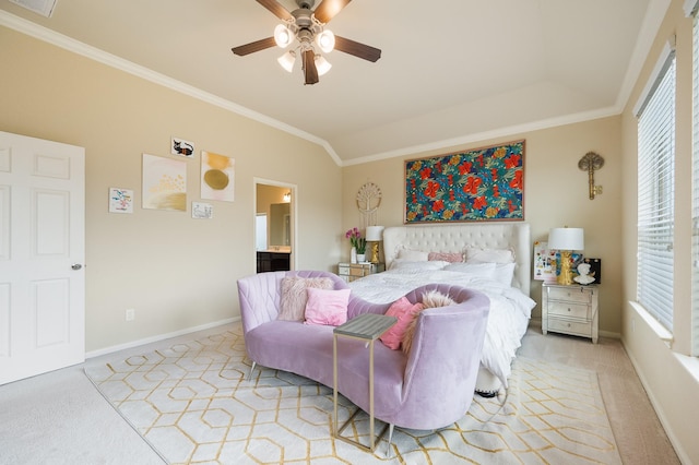 bedroom featuring ceiling fan, connected bathroom, light colored carpet, baseboards, and crown molding