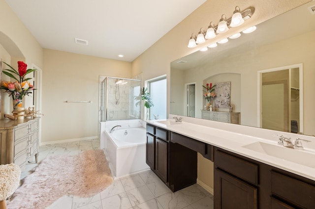 bathroom with a stall shower, visible vents, a sink, marble finish floor, and a bath