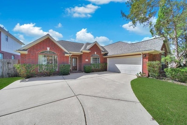 view of front of home featuring concrete driveway, brick siding, an attached garage, and fence