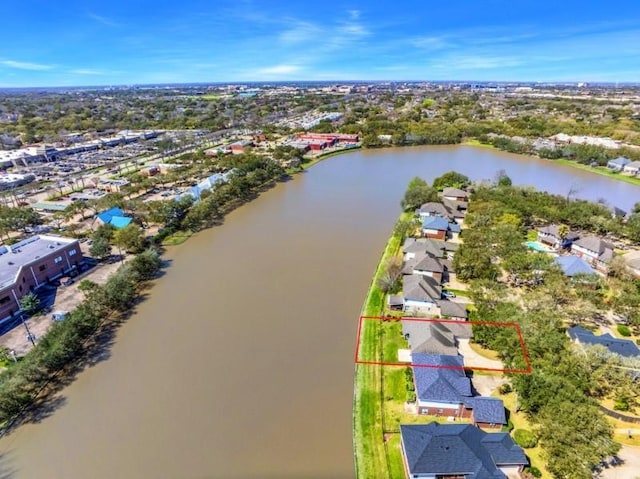 bird's eye view featuring a water view and a residential view