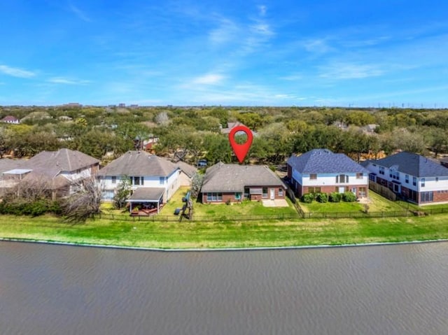 bird's eye view with a water view and a residential view