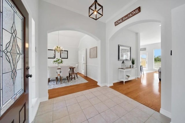 entryway featuring light wood-style floors and baseboards