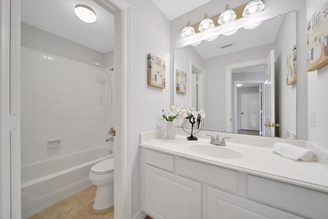 bathroom featuring bathtub / shower combination, toilet, visible vents, vanity, and tile patterned floors