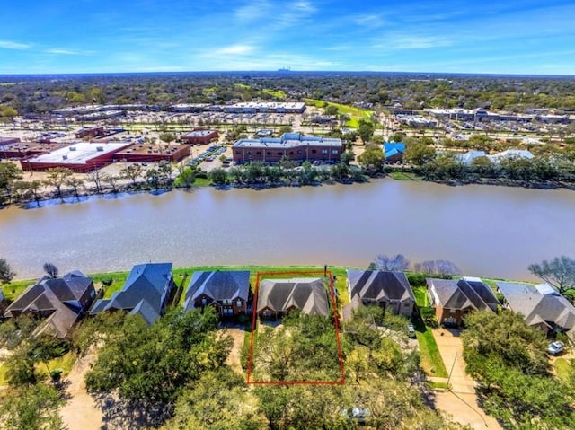 bird's eye view featuring a residential view and a water view