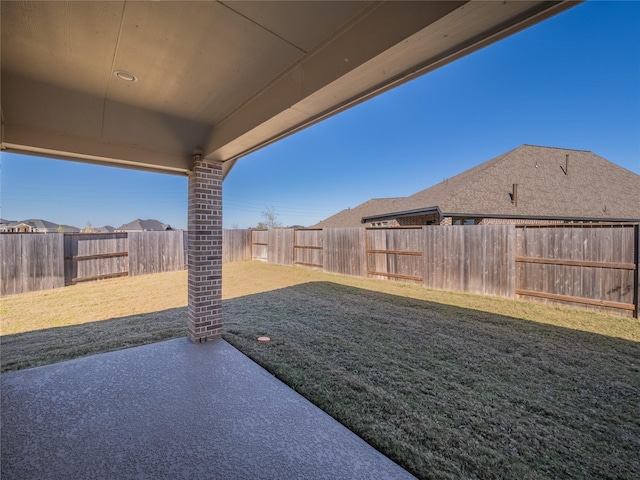 view of yard with a patio and a fenced backyard